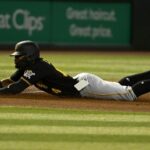 Phone flies out of Pirates 2B's pocket during slide