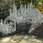 Swiss artist sculpts sprawling model castle on dried river bank