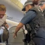 'Can you get off?' Footage has emerged of the moment that Lee Ryan was removed from a British Airways flight at London City Airport by armed police before allegedly being arrested