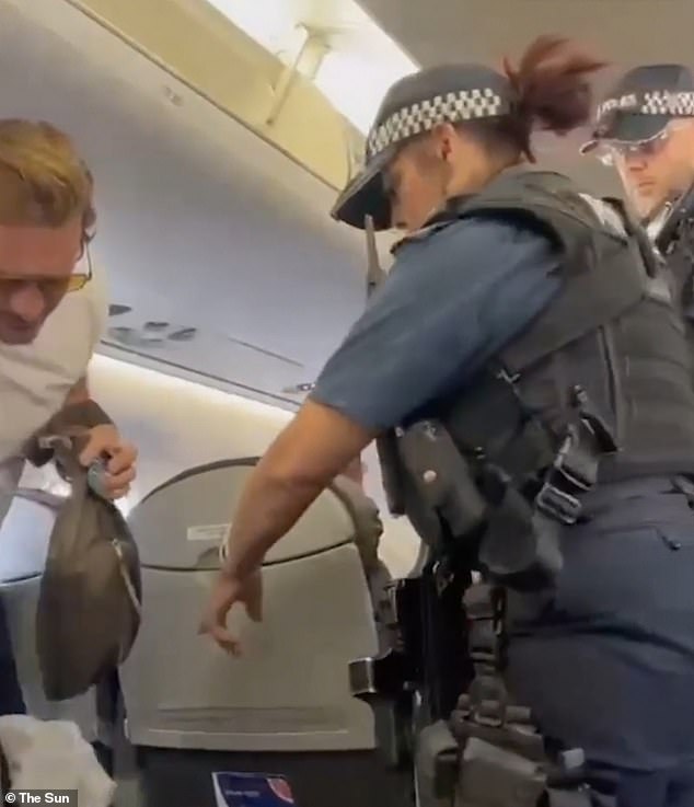 'Can you get off?' Footage has emerged of the moment that Lee Ryan was removed from a British Airways flight at London City Airport by armed police before allegedly being arrested