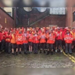 Thousands of British postal workers walk out over pay