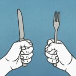 Hungry hands holding fork and knife