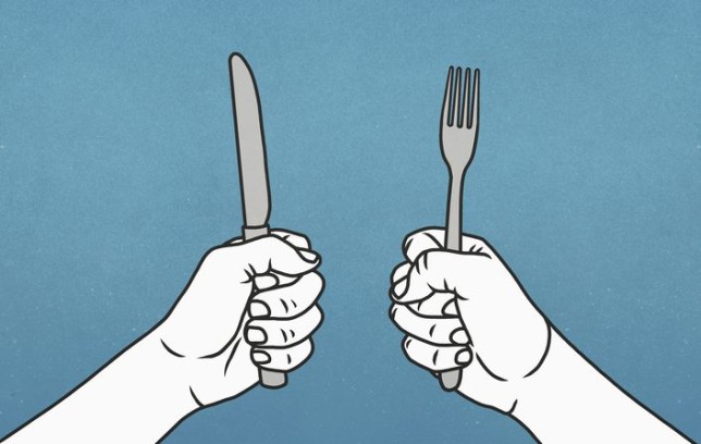 Hungry hands holding fork and knife