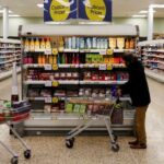 UK economy contracts as households cut spending