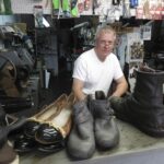 Ukrainian cobbler works, watches war from afar in Colorado