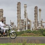 The Reliance Industries Ltd. oil refinery in Jamnagar, Gujarat, India, on Saturday, July 31, 2021. The Indian city of Jamnagar is a money-making machine for Asia's richest man, Mukesh Ambani, processing crude oil into fuel, plastics and chemicals at the world's biggest oil refining complex that can produce 1.4 million barrels of petroleum a day. Photographer: Dhiraj Singh/Bloomberg via Getty Images