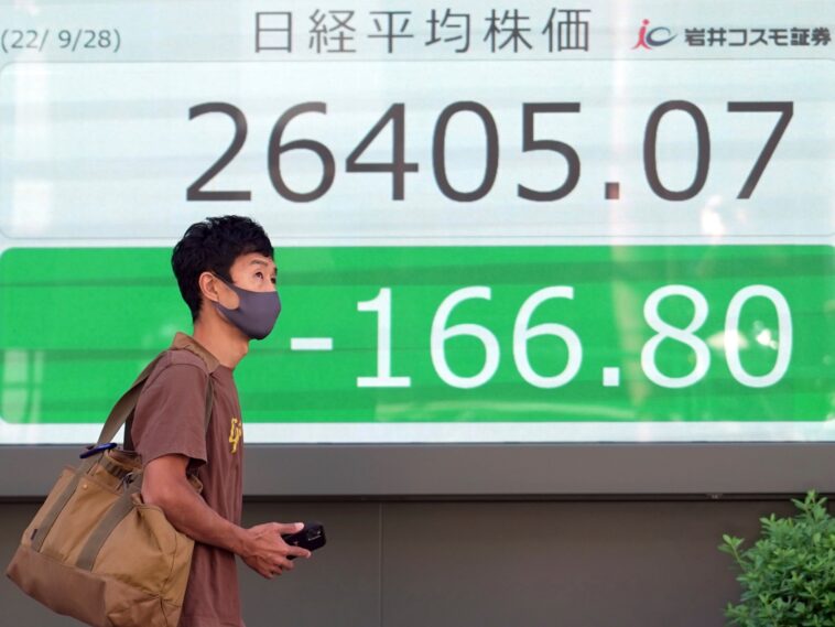 Asian shares tumble after wobbly day on Wall Street