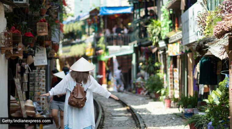 Hanoi, train street cafes in Hanoi, Hanoi train street cafes, Hanoi railway street, indian express news