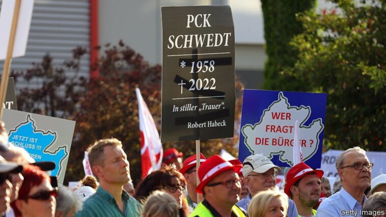 SCHWEDT, GERMANY - JUNE 29: People, including workers from the nearby PCK oil refinery, gather to demand an end to the current, planned German embargo against the import of Russian oil on June 29, 2022 in Schwedt, Germany. Schwedt relies heavily on the jobs at the PCK refinery, and many worry for their economic future since the refinery receives its crude oil exclusively from Russia via the "Friendship" ("Druzhba") pipeline. Germany plans to end its imports of Russian oil within the near future due to Russia's ongoing war in Ukraine and is also seeking to possibly nationalize the refinery, which is currently majority-owned by Russian energy company Rosneft. (Photo by Omer Messinger/Getty Images)