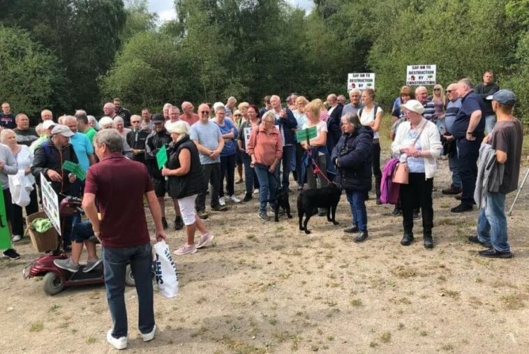 Hundreds stage protest against housing development