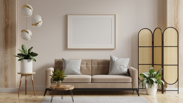 Mock up poster frame in modern interior background with sofa and accessories in the room.