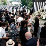 People gather to mourn Japan's former Prime Minister Shinzo Abe near Nippon Budokan in Chiyoda Ward, Tokyo on September 27, 2022, the day of his state funeral.