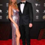 Joel Selwood's stunning wife Brit showed off her baby bump in a sexy thigh split sequin dress as she arrived at the Brownlow Medal count with husband at the Crown Casino in Melbourne on Sunday evening. Both pictured