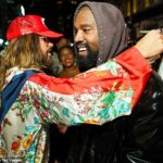 Pure joy: Kanye West was the picture of happiness on Monday night as he shared a warm hug with Jared Leto at the Vogue World: New York fashion show as part of New York Fashion Week