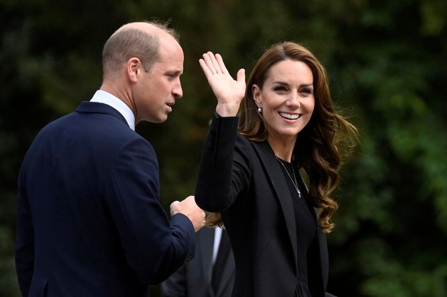 Britain's William, Prince of Wales and Kate, Princess of Wales wave as they view floral tributes left by members of the public, in memory of late Queen Elizabeth II, at the Sandringham Estate, in Norfolk, England, Thursday, Sept. 15, 2022. Queen Elizabeth II, Britain's longest-reigning monarch died Thursday Sept. 8, 2022, after 70 years on the throne. (Toby Melville/Pool via AP)