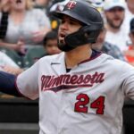 Twins' Sanchez just misses teammate's bat swing