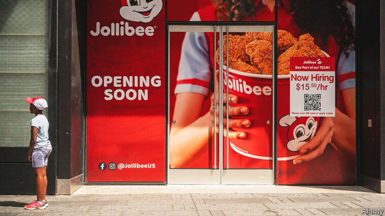 2JN7FCD A sign outside the future home of a Jollibee Filipino fast food restaurant in Times Square in New York advertises that it is hiring prior to its opening on Sunday, July 31, 2022. (© Richard B. Levine)