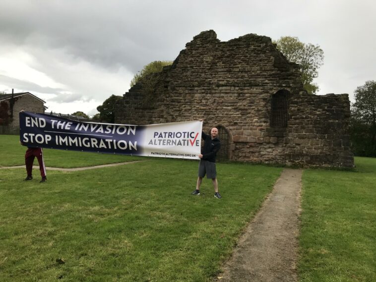 'Abhorrent' anti-immigration leaflets posted and banner held up in front of tower