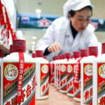 Mandatory Credit: Photo by Xinhua/Shutterstock (11085969a)A worker conducts packaging works at a distillery in Maotai town of Renhuai, southwest China's Guizhou Province, Nov. 27, 2020. Maotai is a small town in Renhuai City in mountainous Guizhou. What distinguishes it from other towns is that it produces a famous brand of Chinese liquor Moutai. The spirit, made from sorghum and wheat, takes up to one year for the whole production process, involving nine times of steaming, eight times of fermentation and seven times of distillation, before aged in clay pots.China Guizhou Renhuai Moutai Liquor - 27 Nov 2020