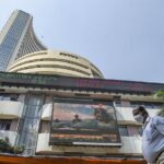 People walk past the Bombay Stock Exchange (BSE) building, in Mumbai (Photo: PTI)