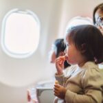 Picture of woman and baby on airplane