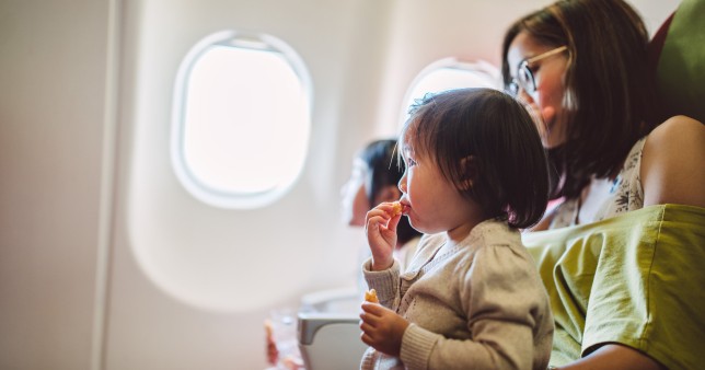 Picture of woman and baby on airplane