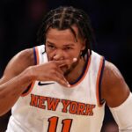 Jalen Brunson #11 of the New York Knicks gestures after making a three point basket during the first quarter of the game against the Orlando Magic at Madison Square Garden on October 24, 2022 in New York City.