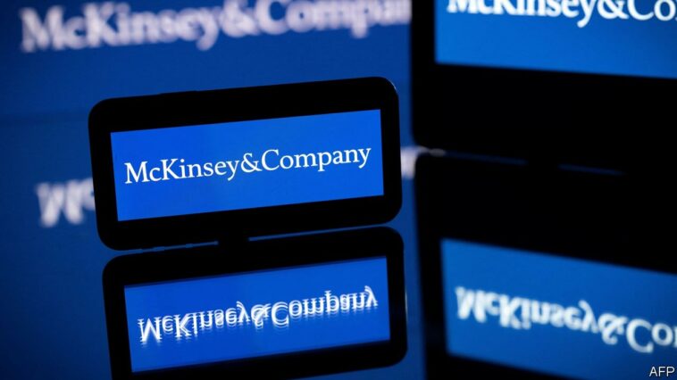 This photograph taken in Toulouse, southern France on April 12, 2022, shows screens displaying the logo of US-based McKinsey & Company management consulting firm. (Photo by Lionel BONAVENTURE / AFP)