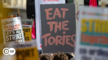 UK protesters burn energy bills over PM Truss' mini budget