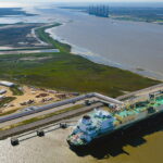 The Asia Vision LNG carrier ship sits docked at the Cheniere Energy Inc. terminal in this aerial photograph taken over Sabine Pass, Texas, U.S., on Wednesday, Feb. 24, 2016. Cheniere said in a statement last month. Cheniere Energy Inc. expects to ship the first cargo of liquefied natural gas on Wednesday to Brazil with another tanker to be loaded a few days later, marking the historic start of U.S. shale exports and sending its shares up the most in more than a month. Photographer: Lindsey Janies/Bloomberg via Getty Images