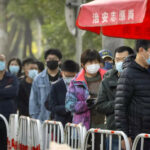 China shortens quarantine times, eases flight curbs in Covid Zero pivot