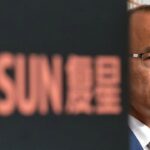 Guo Guangchang, chairman and co-founder of Fosun International Ltd., attends a news conference in Hong Kong, China, on Wednesday, Aug. 29, 2018. Fosun, the last of China's serial acquirers buying high-profile assets, reported higher profits amid gains from its investment division. Photographer: Paul Yeung/Bloomberg via Getty Images