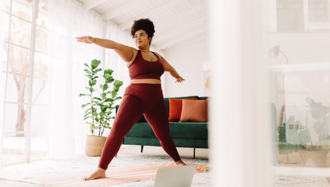 Healthy woman doing exercise at home