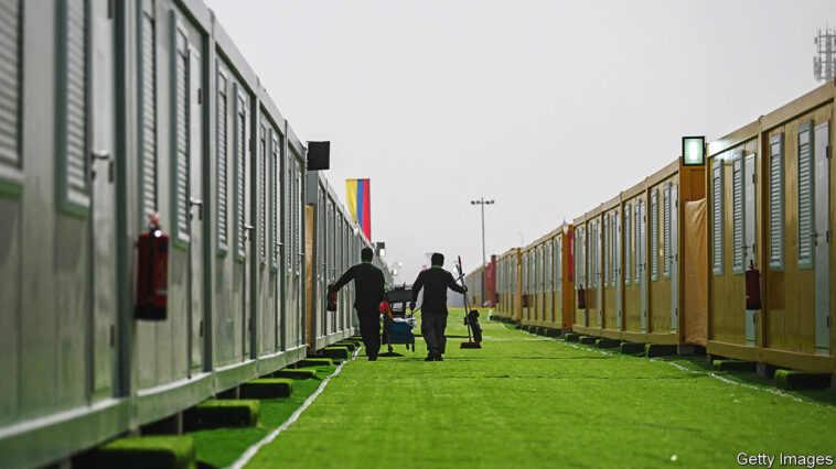 Employees prepare cabins at the Al-Emadi fan village in Doha on November 9, 2022, ahead of the Qatar 2022 FIFA World Cup football tournament. (Photo by Kirill KUDRYAVTSEV / AFP) (Photo by KIRILL KUDRYAVTSEV/AFP via Getty Images)