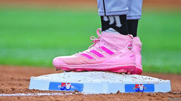 Aug 7, 2022; Arlington, Texas, USA; A view of the pink Adidas baseball shoes of Chicago White Sox left fielder Eloy Jimenez (74) during the fourth inning against the Texas Rangers at Globe Life Field. Mandatory Credit: Jerome Miron-USA TODAY Sports