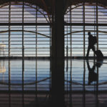 *** BESTPIX *** ARLINGTON, VIRGINIA - NOVEMBER 22: A passenger walks through Ronald Reagan Washington National Airport on November 22, 2022 in Arlington, Virginia. Airlines are preparing for an increase in passengers over the Thanksgiving holiday weekend with demand expected to reach near pre-pandemic levels. (Photo by Kevin Dietsch/Getty Images)