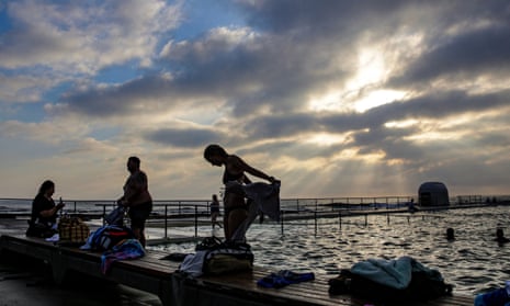 People take an early morning swim at Merewether baths on Christmas Day in Newcastle, NSW.