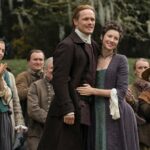 OUTLANDER, from left: Caitlin O'Ryan, Sam Heughan, Caitriona Balfe, The Fiery Cross, (Season 5, Episode 501, aired Feb. 16, 2020). photo: Aimee Spinks / Starz / Courtesy Everett Collection