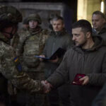 Ukraine's president visits combat zone; Putin rallies forces