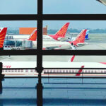 FILE- Air India planes are parked at Indira Gandhi International Airport in New Delhi, India on Aug. 30, 2021. Indian police have arrested an unruly airline passenger following a complaint by a woman aboard an Air India flight from New York that he urinated on her in business class. (AP Photo/Manish Swarup, File)