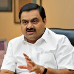 2D0N97D Indian billionaire Gautam Adani speaks during an interview with Reuters at his office in the western Indian city of Ahmedabad April 2, 2014. The way billionaire Indian infrastructure-builder Adani sees it, working with the government does not make him a crony-capitalist. Adani's rapid ascent to the top tier of Indian business is often associated with the rise of Narendra Modi, the Hindu nationalist opposition leader widely expected to become India's next prime minister once the country's election ends next month. Its flagship Adani Enterprises soared 22.9 percent for its biggest daily gain on