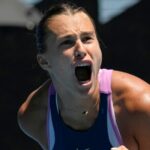 Aryna Sabalenka of Belarus celebrates after defeating Belinda Bencic of Switzerland in their fourth round match at the Australian Open tennis championship in Melbourne, Australia, Monday, Jan. 23, 2023. (AP Photo/Aaron Favila)