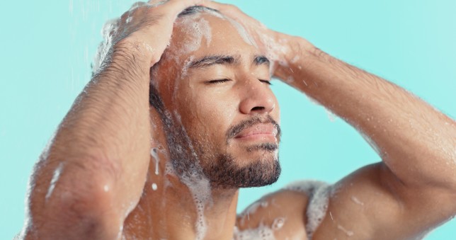 Man washing his hair in the shower