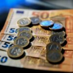 Euro regains ground against dollar as global economic outlook improves