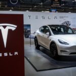 A Tesla Model Y on display at a trade show.