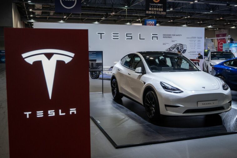 A Tesla Model Y on display at a trade show.