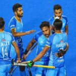 Hardik Singh (8) of India with teammates celebrates after scoring a goal against Spain during a matc