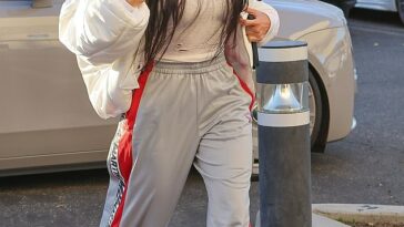 Chic: Kim Kardashian looked effortlessly stylish as she stepped out at her son Saint's basketball game in Los Angeles on Friday