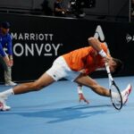 Tennis - Adelaide International - Memorial Drive Tennis Club, Adelaide, Australia - January 7, 2023 Serbia's Novak Djokovic reacts after sustaining an injury during his semi final match against Russia's Daniil Medvedev