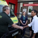 Rishi Sunak shaking hands with an ambulance driver during a visit to the University Hospital of North Tees this morning.